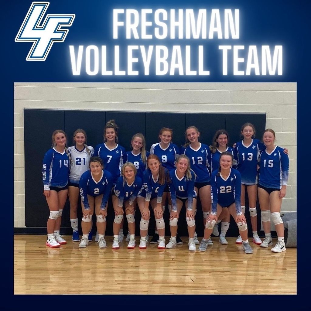 Freshman Volleyball Team in the gym posing for a picture