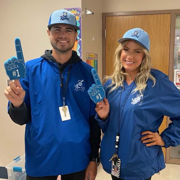 2 teachers dressed in spirit wear