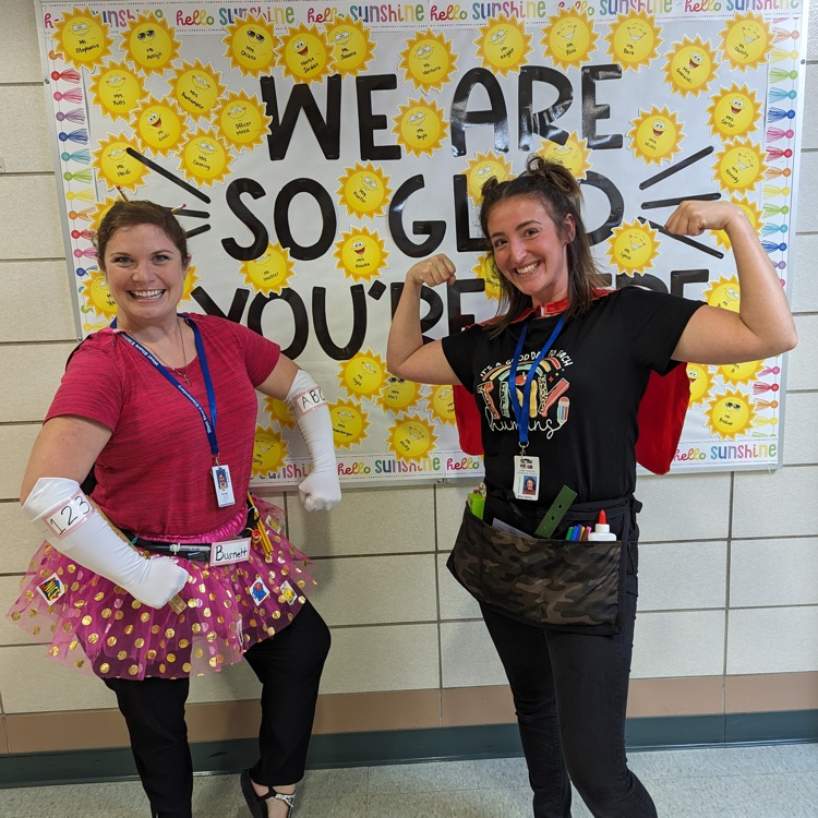 2 teachers dressed like super hero’s 