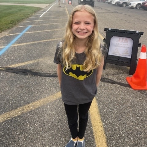 girl wearing Batman shirt