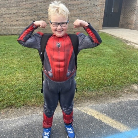 student dressed like superhero
