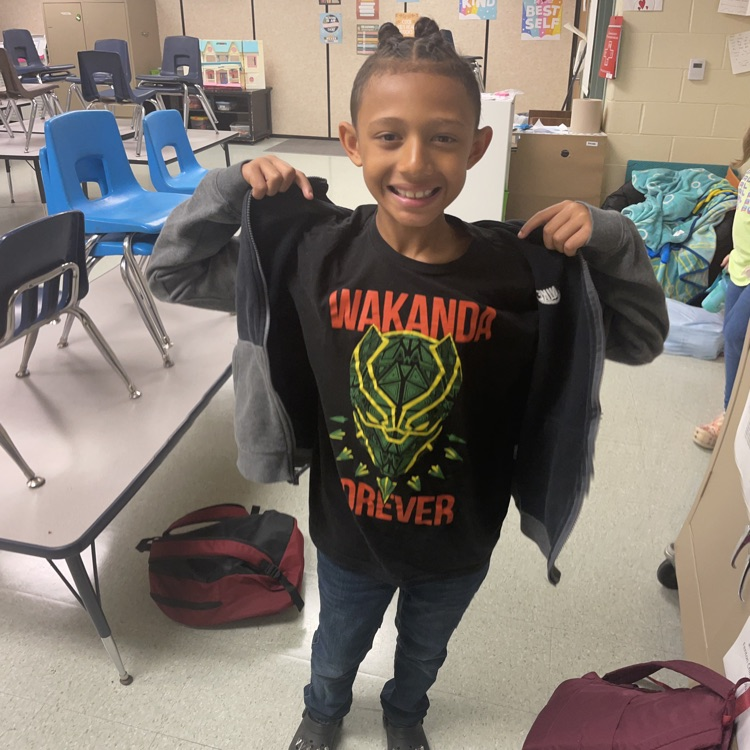 student with superhero shirt