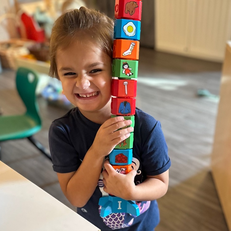 boy holding blocks