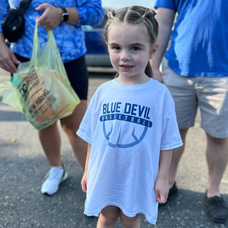 girl wearing blue devil shirt