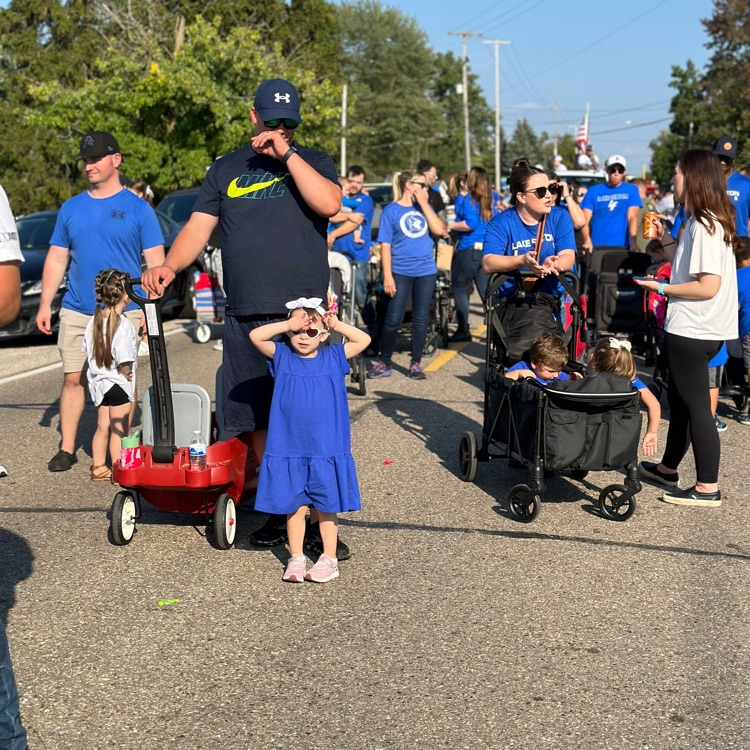 families walking in parade