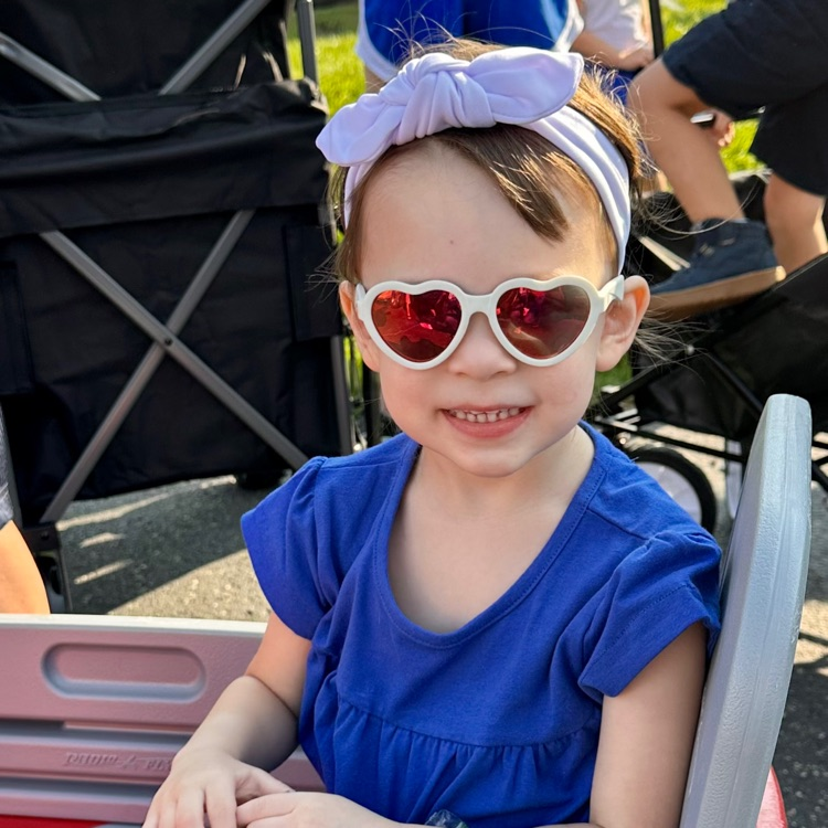 little girl in heart glasses
